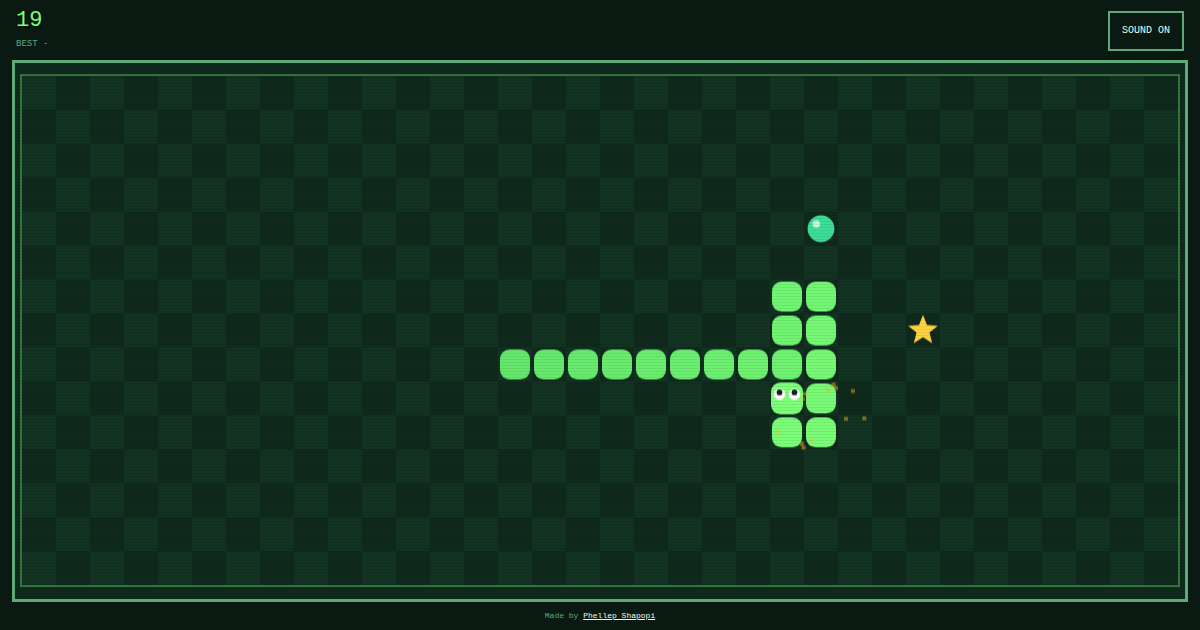 A green snake growing along a checkered board toward candy